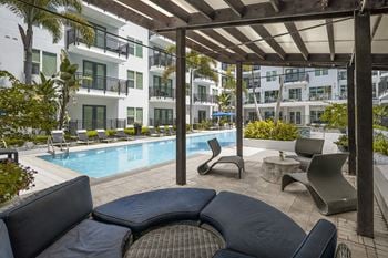 Infinity edge swimming pool with cabanas